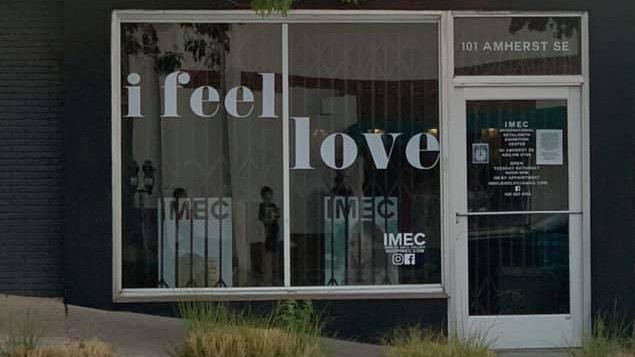 A storefront reading "i feel love".