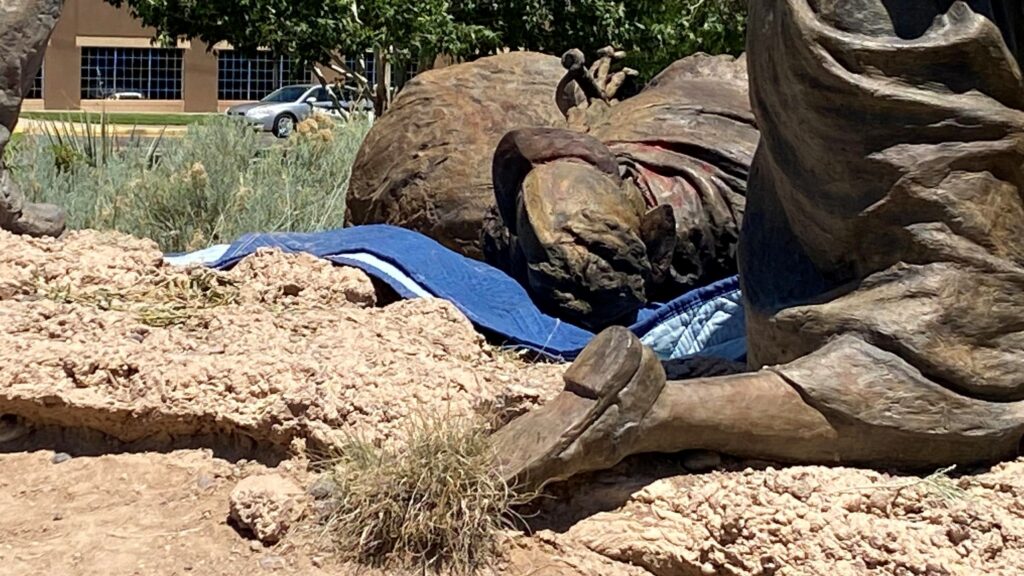 Statue of Oñate lying on the ground.