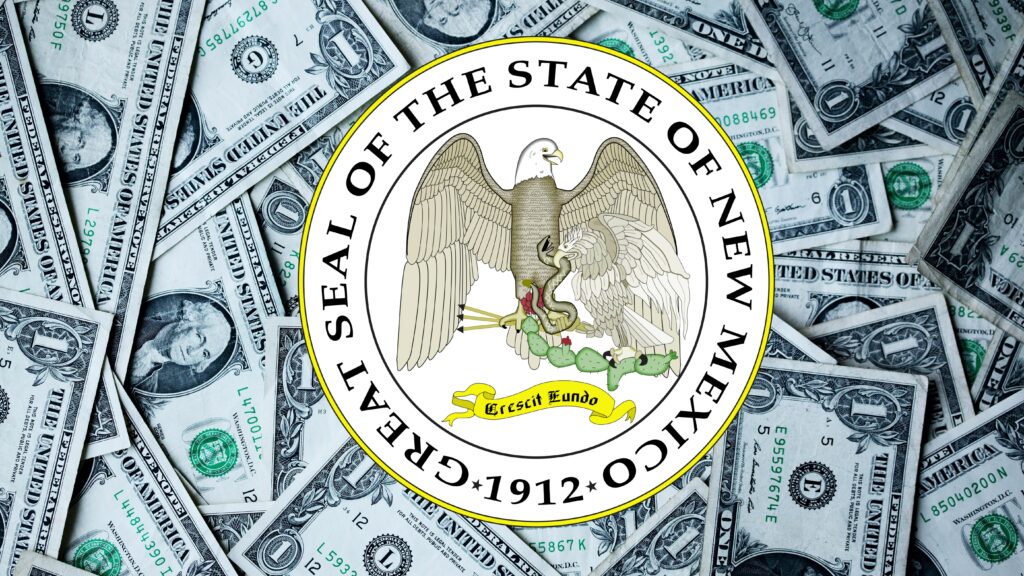 Composite of the seal of New Mexico above a pile of $1 dollar bills.