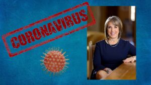 Composite of portrait of Michelle Lujan Grisham, a CG illustration of a coronavirus, and red text reading "CORONAVIRUS".