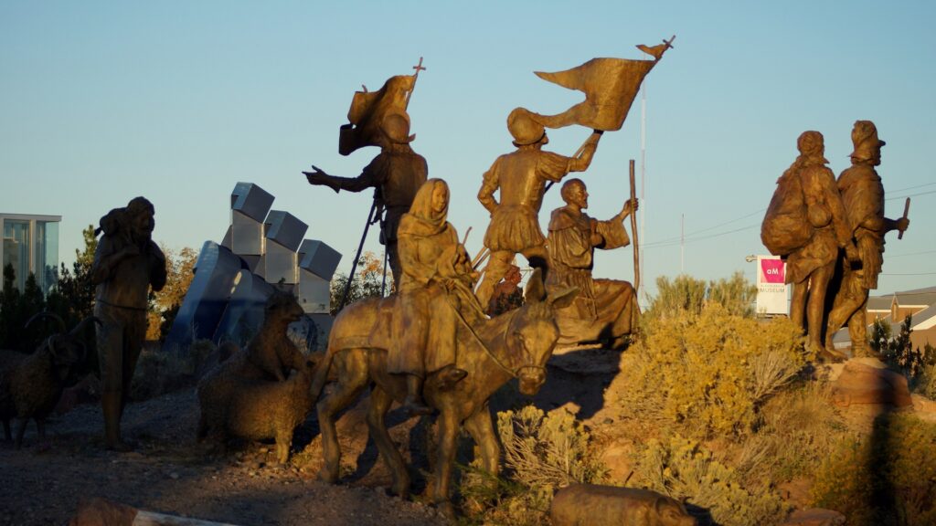 A monument featuring various soldiers and people on horseback.