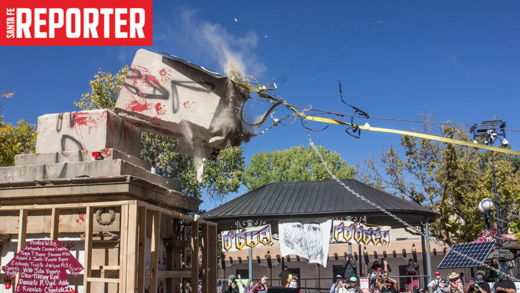 Image from the Santa Fe Reporter featuring a vandalized statue being torn down as demonstrators look on.