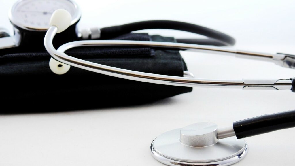 Low view of a stethoscope and blood pressure cuff.