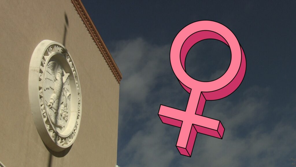 Composite of the Santa Fe Roundhouse, and the female gender symbol.