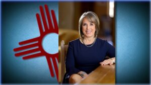 Composite of portrait of Michelle Lujan Grisham in front of a Zia sun symbol.