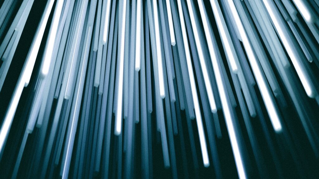 Bright cables hang down from above.