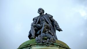 Low-view of a statue of William Shakespeare.