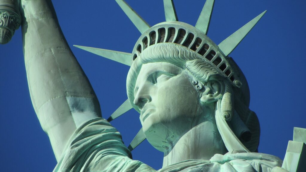 Close-up of the head of the Statue of Liberty on a clear day.