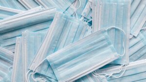 A clutter of surgical facemasks.