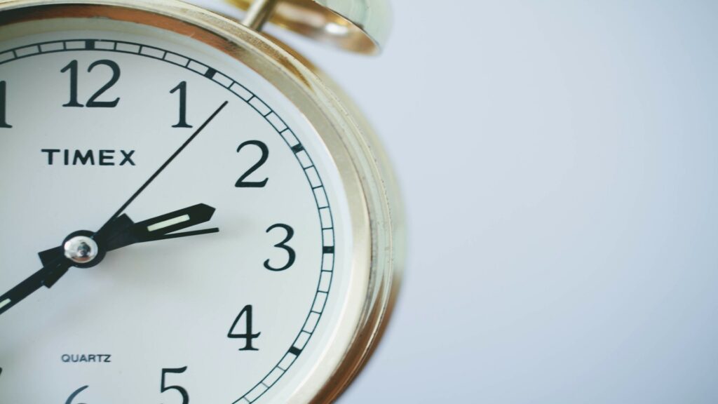 Close-up of a golden alarm clock.