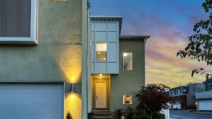 A house in a residential neighborhood at dusk.