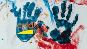 Hand prints with paint and the logo for CYFD.