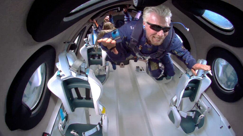 A person experiencing zero gravity and floating in a spaceship cabin.