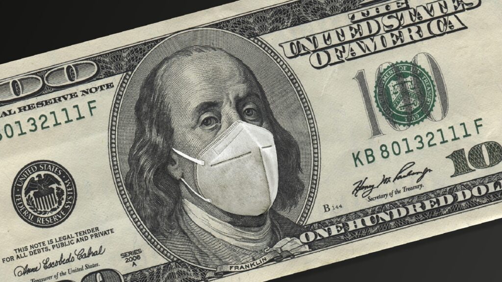 A $100 dollar bill, with a facemask covering Benjamin Franklin's face.