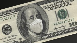 A one hundred dollar bill with Benjamin Franklin wearing a mask