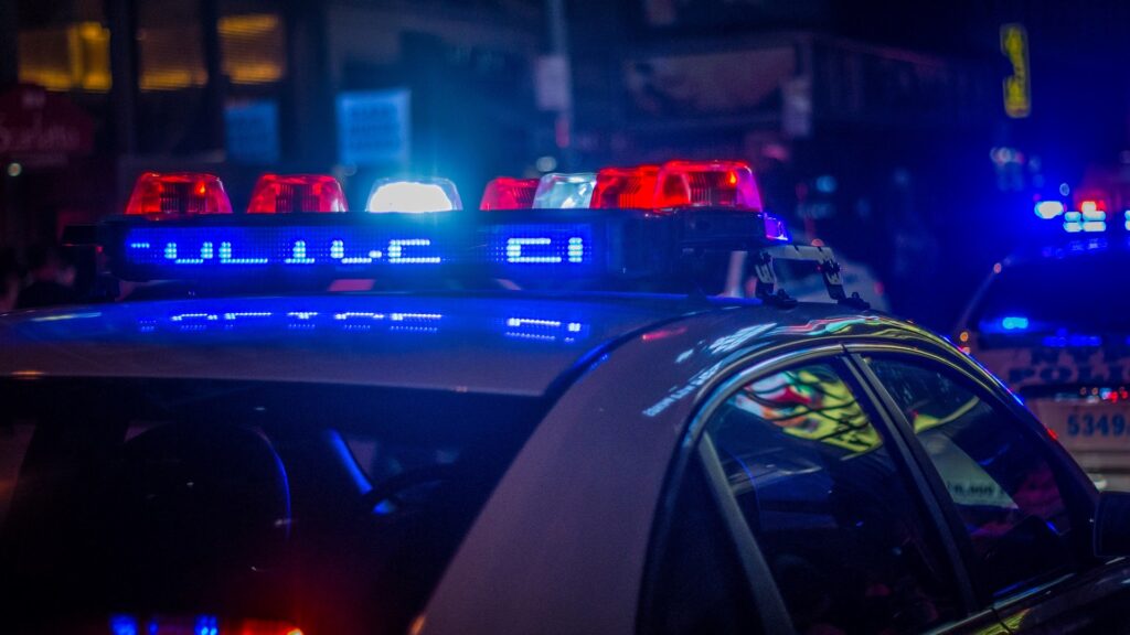A Police Patrol Car with Lights On