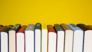 books lined up in front of a yellow background