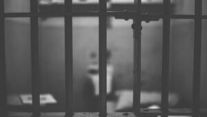 Blurry image of a jail cell.