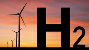 The silhouette of wind turbines on top of a pink and yellow sunset with the letters "H2" superimposed.