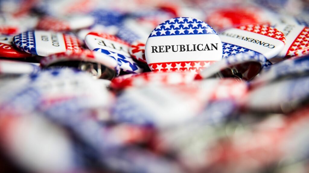 A pile of voting themed buttons with one "Republican" button in focus.