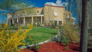 The Roundhouse surrounded by colorful landscaping.