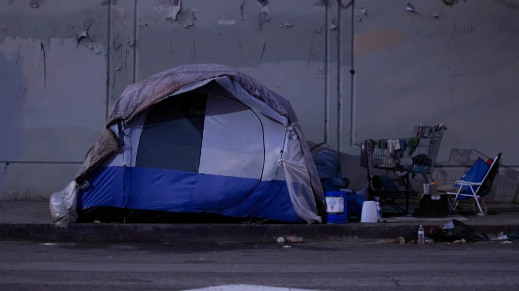 A tent on the side of the road.