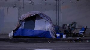 A tent on the side of the road.