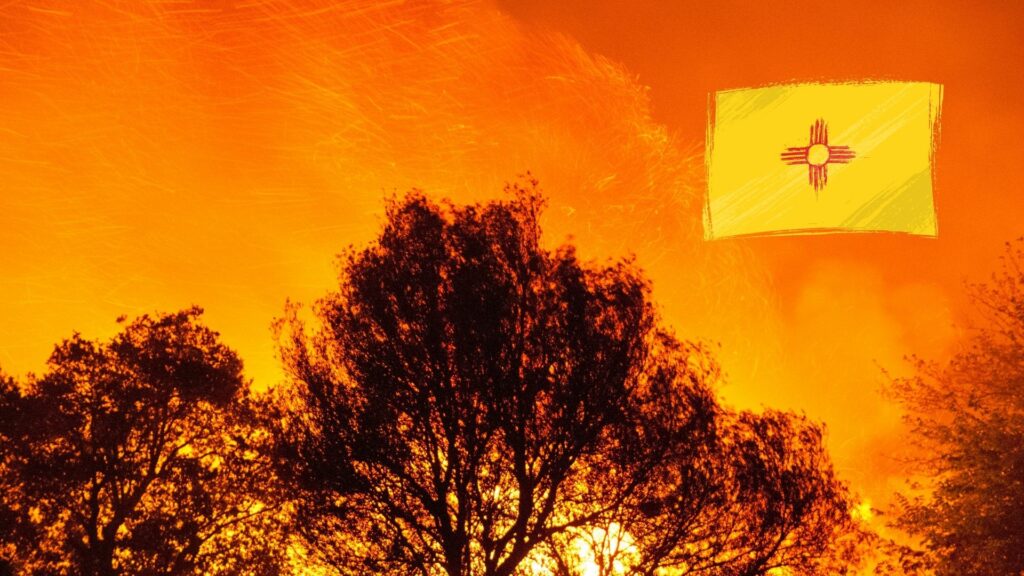 A orange sky from a wildfire with the New Mexico State Flag superimposed.