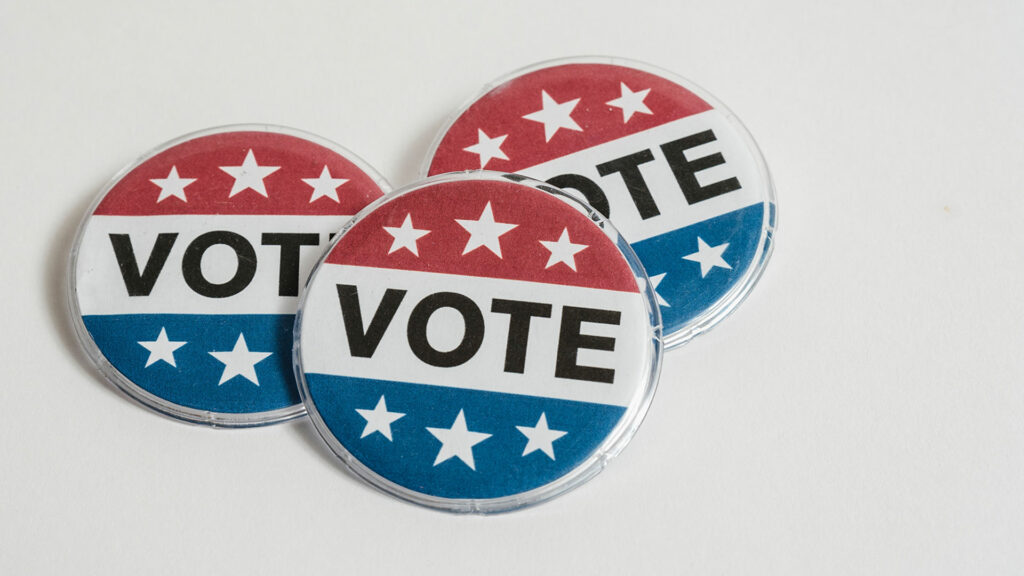Three "vote" buttons on a white surface.