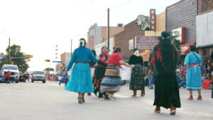 People dancing in the street at the 100th Inter-Tribal Ceremonial in Gallup