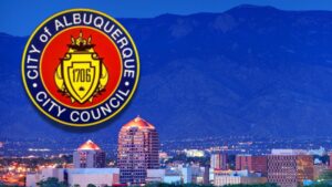 The skyline of downtown Albuquerque with the logo for The City of Albuquerque City Council.