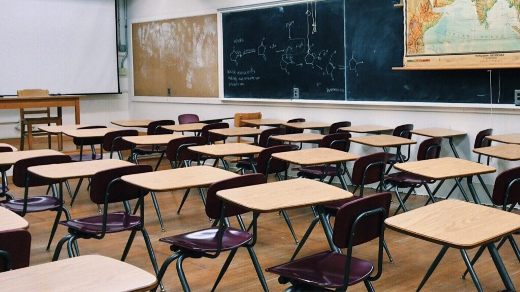 A science classroom full of empty desks.