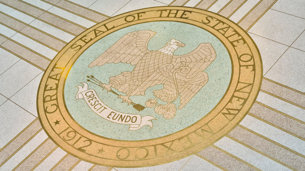 The seal of the state of new mexico on the floor.