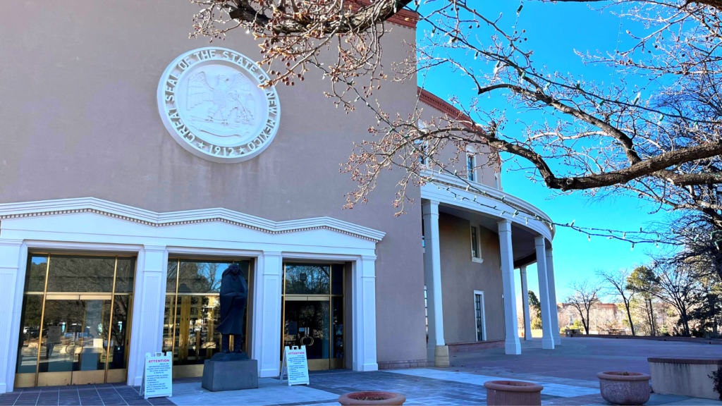 The front of a building with a tree in front of it.