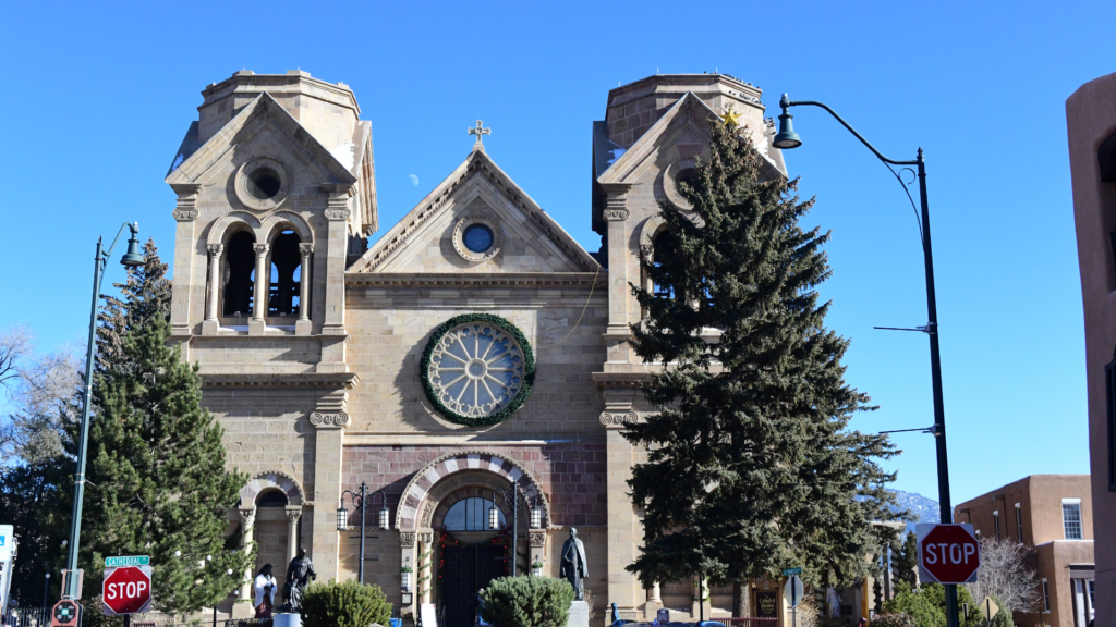 A large stone building with a clock tower.