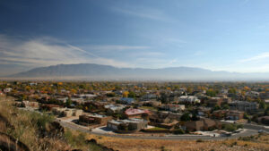 An overview shot of a neighborhood and the Sandia mountains in Albuquerque.