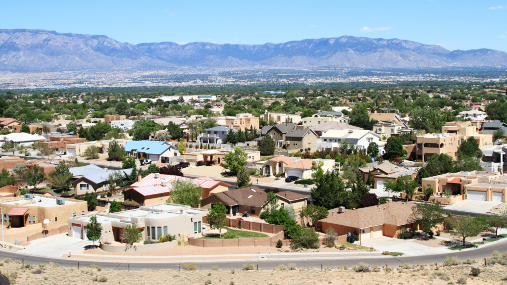 An overview shot of a neighborhood and the Sandia mountains in Albuquerque.