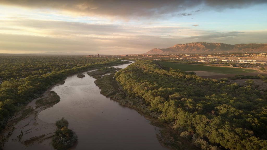 An aerial view of a river and mountains.