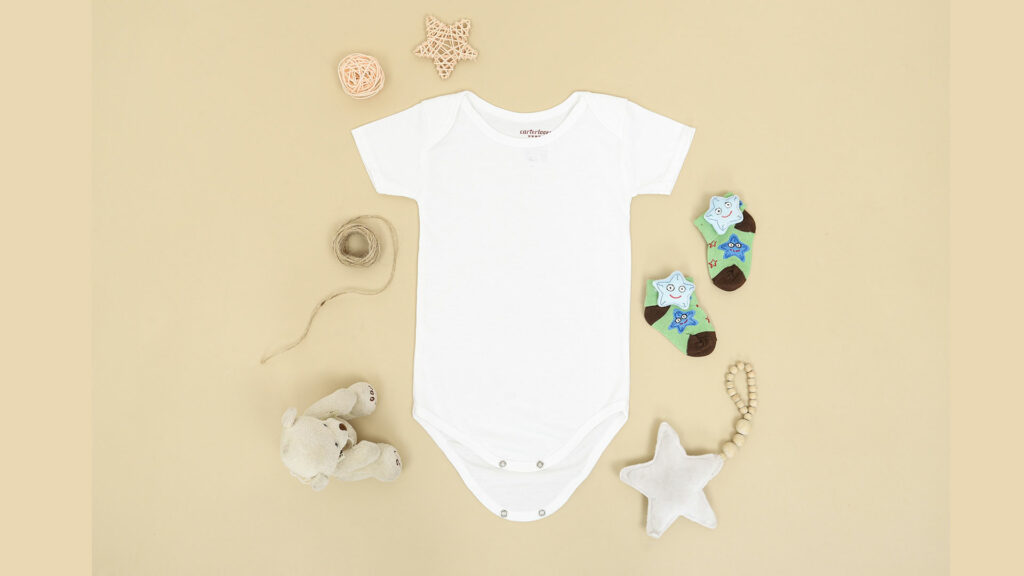 A white baby bodysuit with a star and teddy bears.
