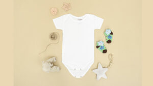 A white baby bodysuit with a star and teddy bears.