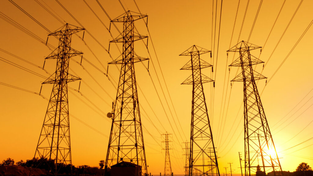 High voltage pylons at sunset.