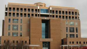 A large tan building with many windows.