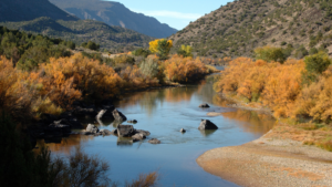 A river surrounded by mountains.