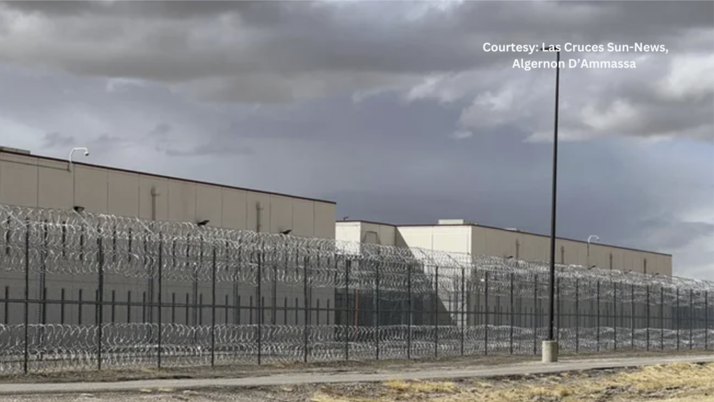 An image of a prison with a barbed wire fence.