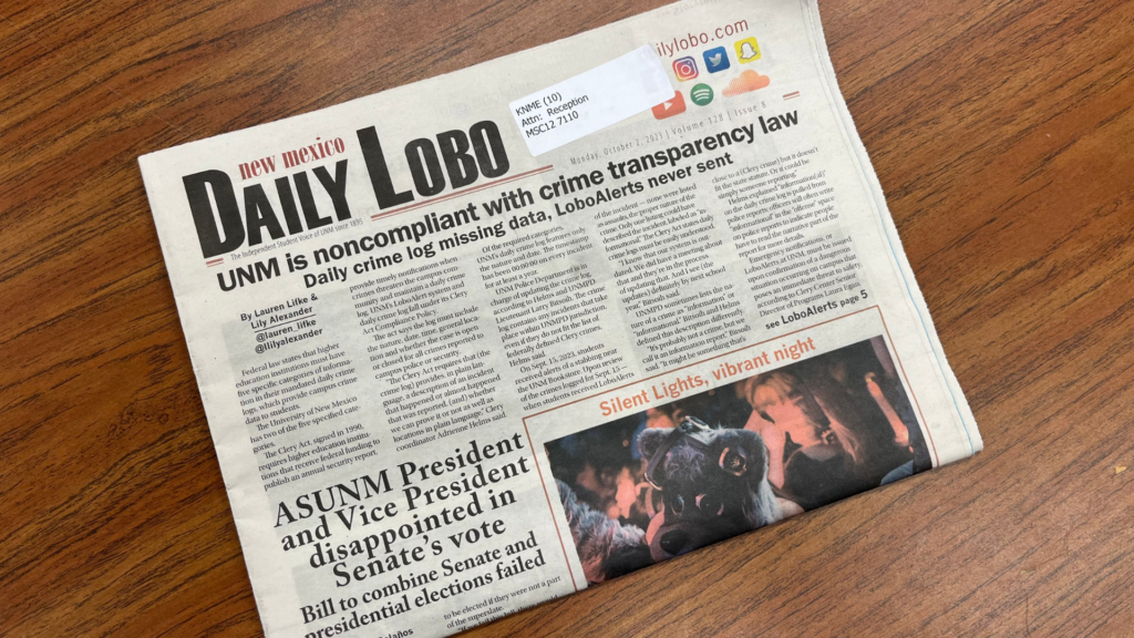 A newspaper with the daily lobo on it.