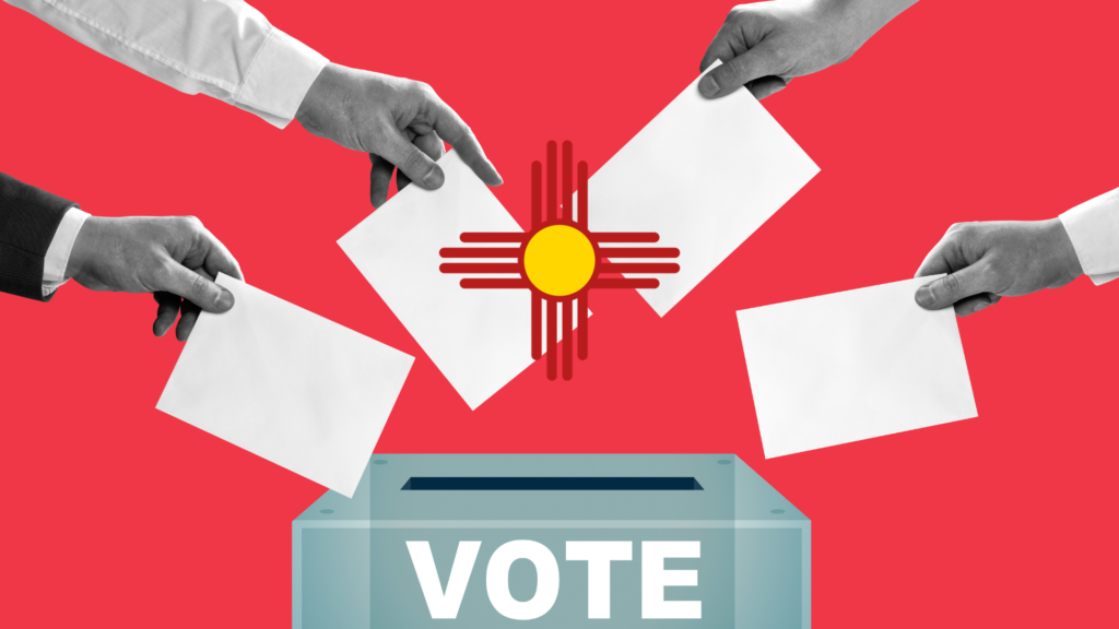 Hands putting papers into a voting box in new mexico.