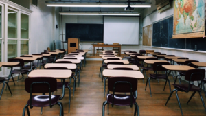 Desks and chairs in a classroom.