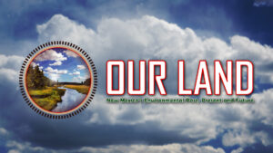 Our land logo with clouds in the background.
