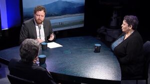 A group of men sitting at a table.