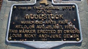 Plaque marking the original site of the woodstock music and arts fair held in august 1969, erected by owners in 1984.